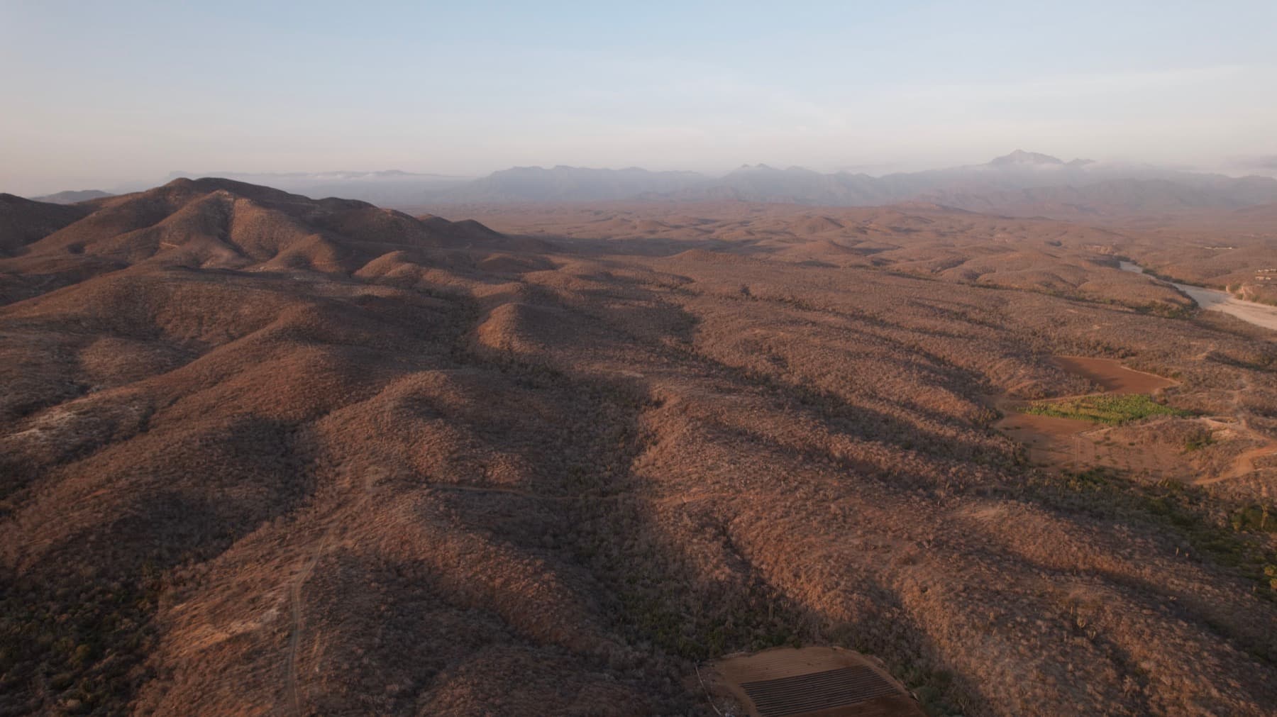 The sierra behind the development